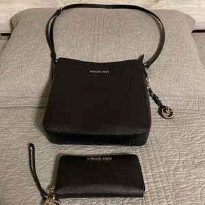 Michael Kors crossbody and matching wallet light used